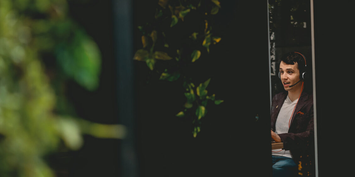 man on a call using a headset in an office