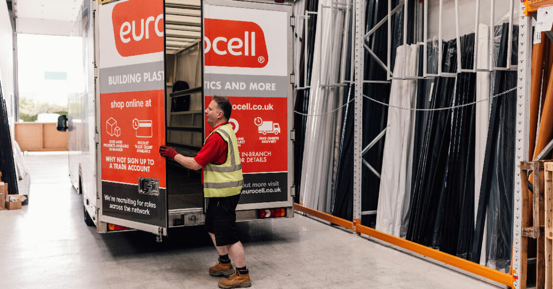 A Eurocell employee loading a branded van